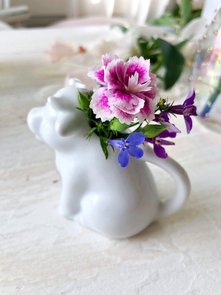 Cow creamer filled with tiny blooms - Dream.Love.Paint cottage - Dreama Tolle Perry https://dreamatolleperry.com/